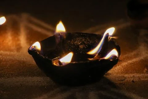 Burning candle in the dark Stock Photos