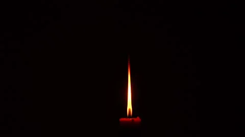 A burning candle in a dark room. Видео 156896814