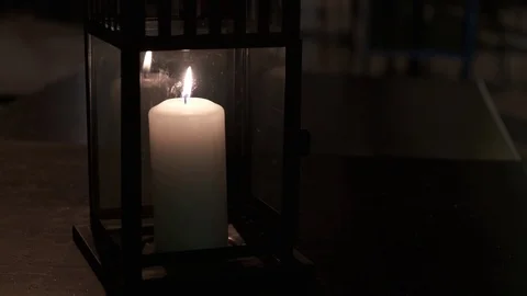 Burning candle in the dark on a table in outdoors cafe.. Stock Footage 124245909