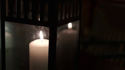 Burning candle in the dark on a table in outdoors cafe.. Stock Footage 124246138