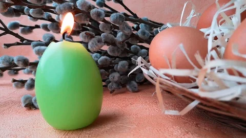 Burning candle, eggs and willow branch Stock Footage 104849765