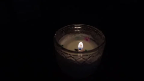 Burning candle flame in dark background Stock Footage 318171722