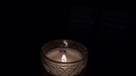 Burning candle flame in dark background Stock Footage 318171751