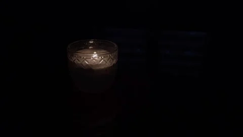 Burning candle flame in dark background Stock Footage 318171753