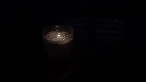 Burning candle flame in dark background Stock Footage 318171763