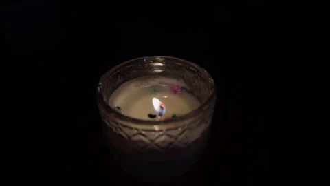 Burning candle flame in dark background Stock Footage 318171775