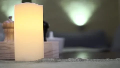 Burning candle flame on the dining table. art to create a home cosiness Video stock 91441633