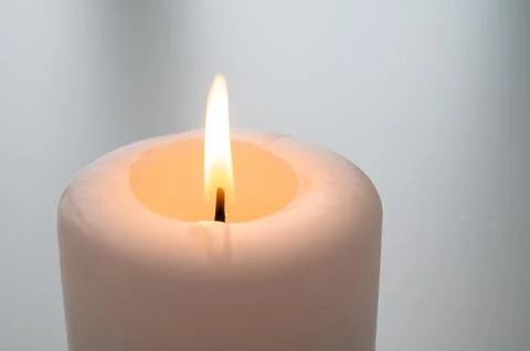 Burning candle flame. Stock Photos