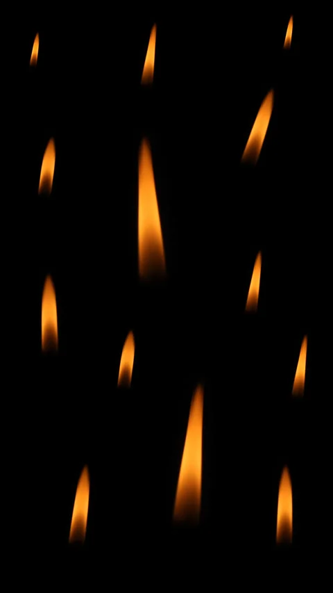 Burning candle flames on a black background. Stock Footage 303895602