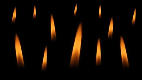 Burning candle flames on a black background. Stock Footage 303896313