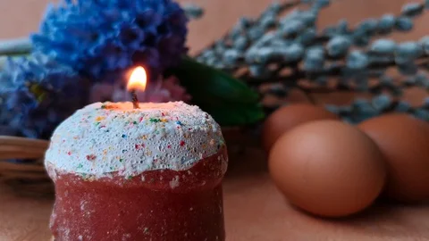 Burning candle, flowers, eggs, willow branches Stock Footage 104849658