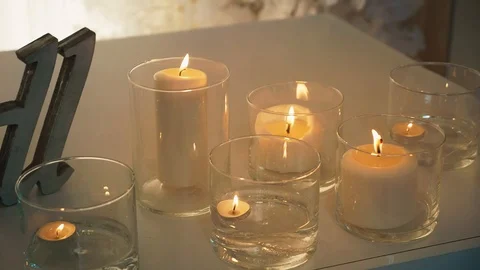 Burning candle in a glass flask Stock Footage 97715515