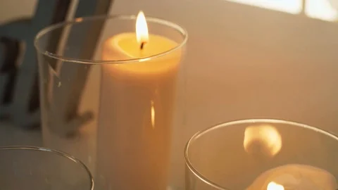 Burning candle in a glass flask Stock Footage 97715925
