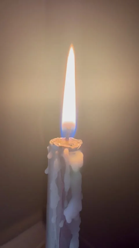 Burning Candle with Glowing Light Rays and Dripping Wax Stock Footage 345306807