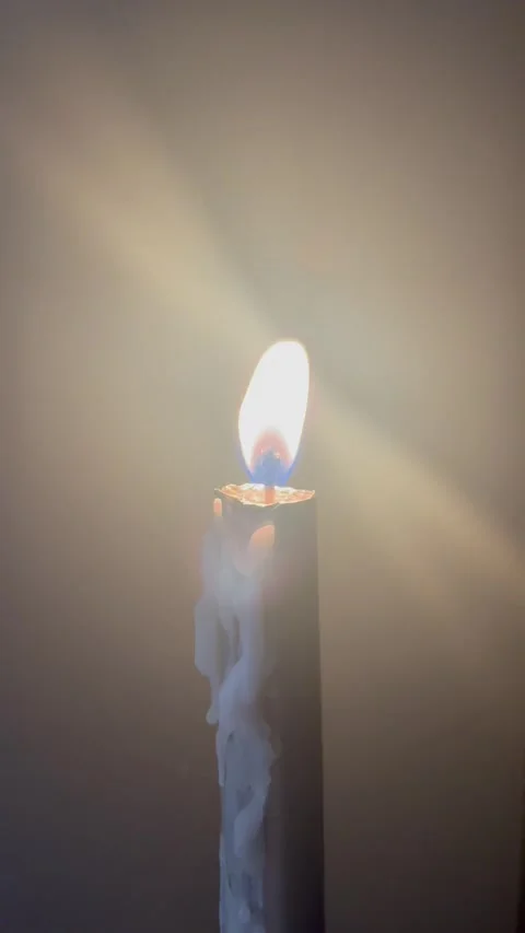 Burning Candle with Glowing Light Rays and Dripping Wax Stock Footage 345306809