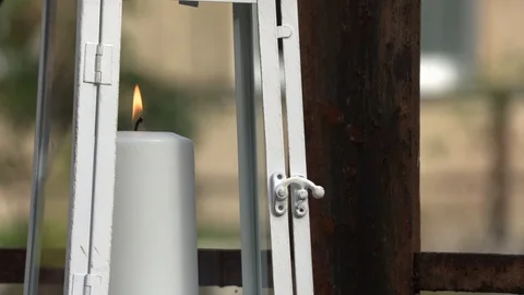 Burning candle in a lantern on an empty bridge Video stock 96103892