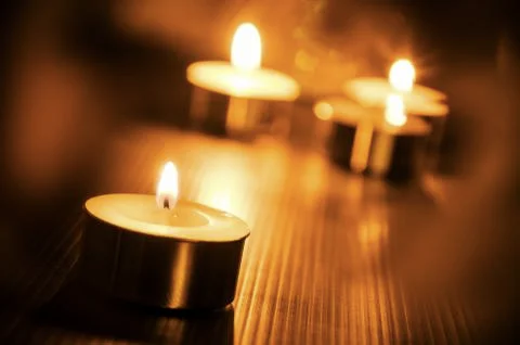 Burning candle light background Stock Photos
