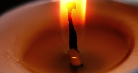 Burning candle in macro view. macro video of a burning candle Stock-Footage 312529730