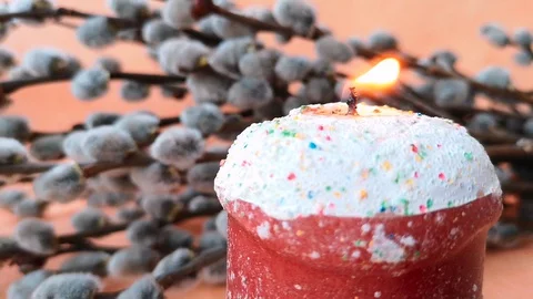 Burning candle made in the shape of an Easter cake Stock Footage 104821745
