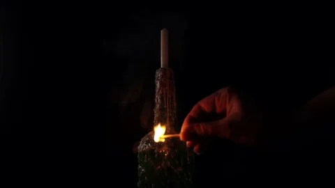 Burning a candle with a match Stock-Footage 126034412
