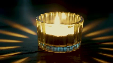 Burning candle, reflection on table, 4K Stock Footage 130876766