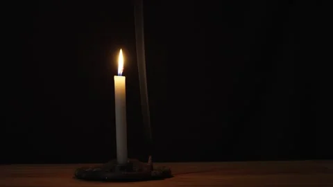 Burning Candle with Smoke in the Dark Stock Footage 333106674