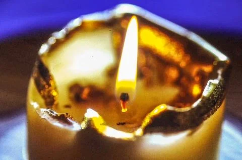 Burning Candle with Soft Warm Light Stock Photos