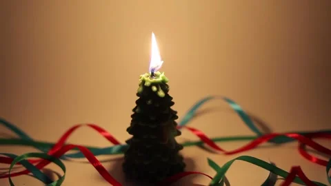 Burning candle with stable flame in shape of fir tree Stock Footage 143660304