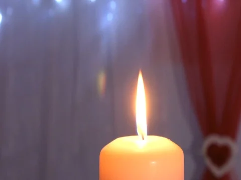 Burning candle on the table Stock Footage 82686874