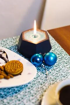 Burning candle on the table Stock Photos