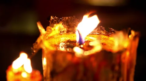Burning candle in temple close up with wax texture and glow 動画素材 45898693