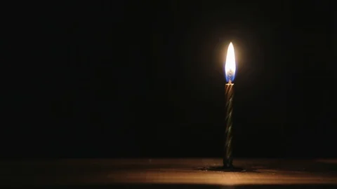 Burning candle timelapse on a black background. 스톡 동영상 117127526