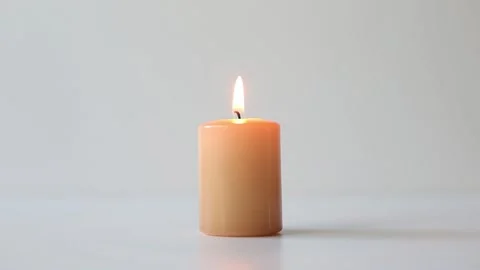 Burning candle on a white background Stock Footage 158807671