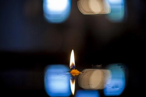 Burning candle on a white background Foto stock