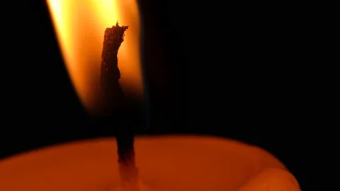 Burning candle wick close-up on a dark background Stock Footage 164620584