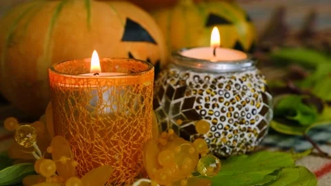 Burning candles against the backdrop of pumpkins. Stock Footage 219253301
