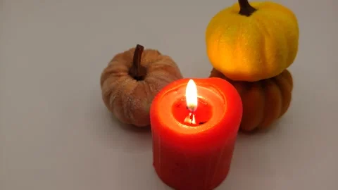 Burning candles and pumpkins composition on a light background Stock-Footage 319790230