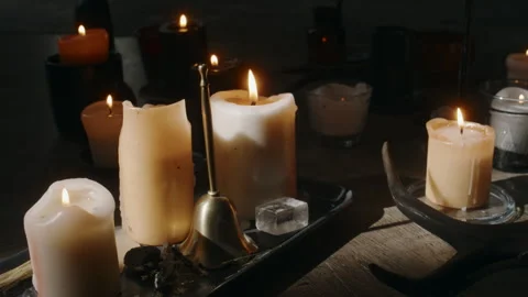 Burning Candles and Wiccan Tools on Wooden Floor Stock Footage 279640214