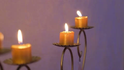 Burning candles in an antique candlestick. Stock Footage 132250778