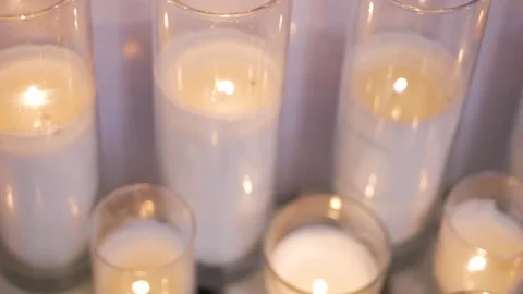 Burning candles in an artificial fireplace. Stock Footage 103325367