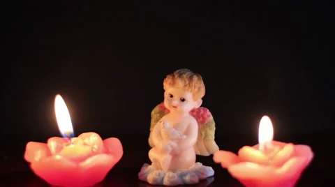 Burning Candles On The Background Of An Angel Stock Footage 47031922
