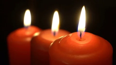 Burning candles on a black background 動画素材 75383757