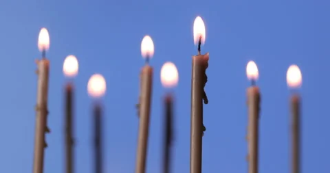 Burning a candles on blue background Stock Footage 143126378