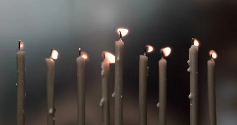 Burning a candles on blurred background Stock Footage 143125851