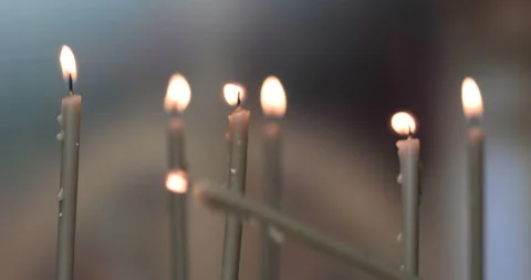 Burning a candles on blurred background Stock Footage 143126196