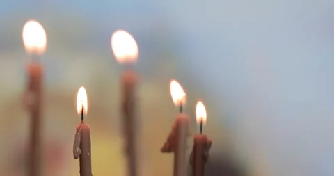 Burning a candles on blurred background Stock Footage 143126724
