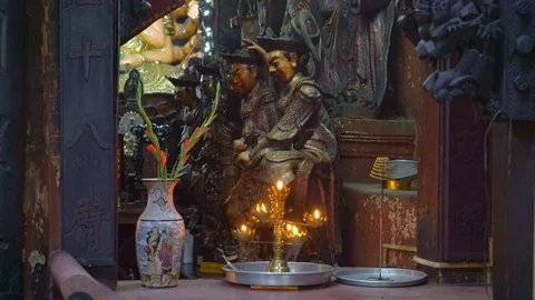Burning candles in a Buddhist temple Stock Footage 73283570