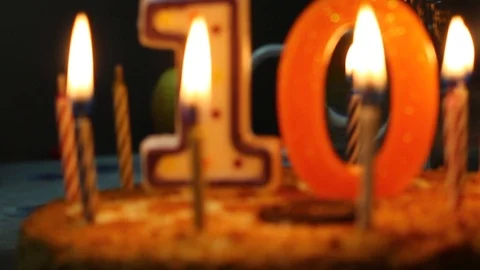 Burning candles on the cake. Ten years. Birthday Stock Footage 109502003