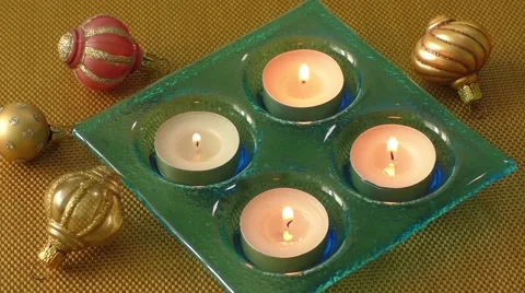Burning candles in a Christmas setting with seasonal decorations Stock Footage