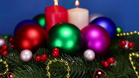 Burning candles on the Christmas tree branches surrounded by Christmas balls Stock Footage 323435872